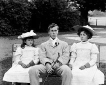 Donald, Gertie and Nona on garden seat Original caption: Donald, Gertie and Nona on garden seat