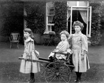 Children & mail cart Sedgeford Hall Original caption: Children and mail cart