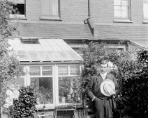 Gent with hat in a garden Original caption: Gent with hat in a garden