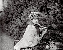 Nona on wicker chair Original caption: Nona on wicker chair