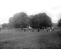 Family at cricket nets Original caption: Family at cricket nets