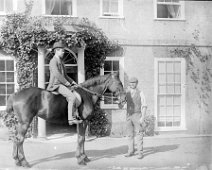 Young man on a horse at Sedgeford hall Original caption: Young man on a horse
