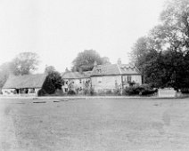 Sedgeford Hall, Walter in hammock Original caption: Our house, Walter in hammock