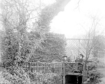 Father, Gertie and Nona on waterfall bridge, from drive Original caption: Father, Gertie and Nona on waterfall bridge, from drive