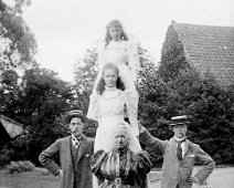 Gilbert, Reggie & Mother holding ladder with Gertie & Nona, Sedgeford Hall Original caption: Gilbert, Reggie and Mother holding ladder with Gertie and Nona