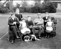 Family group on lawn at Sedgeford Hall Original caption: Family group on lawn