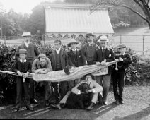 Large group, Mr. B.Case and Mr. Palmer, etc. under awning Original caption: Large group, Mr. B.Case and Mr. Palmer, etc. under awning