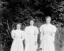 3 girls & boxer dog Original caption: 3 girls and boxer dog