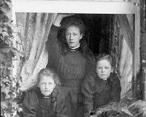 3 girls in window Original caption: 3 girls in window