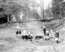 Family in the sandpits Original caption: Family in the sandpits