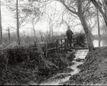 Mr. H. on bridge Sedgeford Hall park Original caption: Mr. H. on bridge