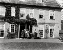 Sedgeford front door with group Original caption: Sedgeford front door with group