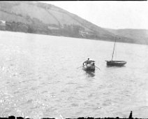 Father + 2 in a dinghy Original caption: Father + 2 in a dinghy