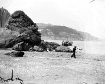 Splat Cove, Salcombe View N from Splat Cove across to North Beach's north side promontory Original caption: Boy in sailor suit on beach