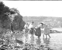 Family group paddling in sea Original caption: Family group paddling in sea