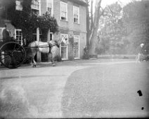 Dog cart by front door Sedgeford Hall Original caption: Dog cart by front door