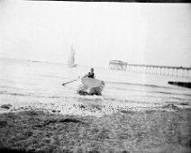 Rowing boat, sailing boat, and a pier Hunstanton Pier Original caption: Rowing boat, sailing boat, and a pier