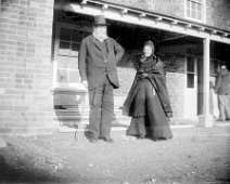 Elderly couple outside new house Rev Ogle and wife outside Brookdale, Church Lane, Sedgeford Original caption: Elderly couple outside new house