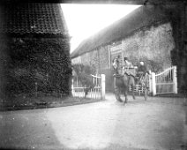 Pony & trap leaving yard Sedgeford Hall Original caption: Pony and trap leaving yard
