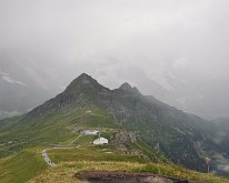 Nikon_20150809_092440 From just below the top of Männlichen Tschuggen and the Lauberhorn The world cup ski run starts on the Lauberhorn and goes down the open grass below and ends in...